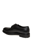 Profilo interno di derby brogue in pelle nera Jerold Wilton con dettaglio del tacco.